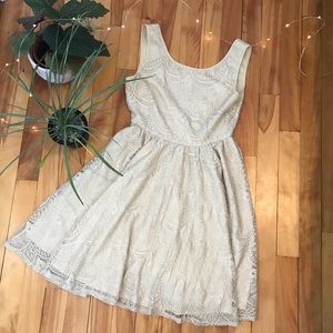 Pale gold low-back skater dress